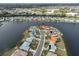Panoramic aerial view of a lakeside community, showing the homes and serene waterfront landscape at 407 Blackhawk Cir, Sun City Center, FL 33573
