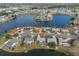 Stunning aerial view of homes nestled along a peninsula, surrounded by picturesque lake views at 407 Blackhawk Cir, Sun City Center, FL 33573