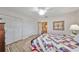 Well-lit bedroom showcasing ample closet space and a comfortable atmosphere at 407 Blackhawk Cir, Sun City Center, FL 33573