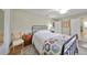 Bright bedroom with a ceiling fan and a large window with a chair at 407 Blackhawk Cir, Sun City Center, FL 33573