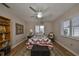 Bedroom featuring natural light and a decorative rug and wood flooring at 407 Blackhawk Cir, Sun City Center, FL 33573
