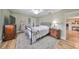 Bedroom with a large bed, ceiling fan, and a TV on a wooden dresser at 407 Blackhawk Cir, Sun City Center, FL 33573