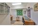 Bright craft room features ample natural light, work spaces, and storage at 407 Blackhawk Cir, Sun City Center, FL 33573
