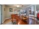 Open concept: Dining room seamlessly connects to the kitchen with white appliances at 407 Blackhawk Cir, Sun City Center, FL 33573