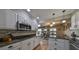 A beautifully updated kitchen with stainless steel appliances, granite countertops, and ample cabinet space at 407 Blackhawk Cir, Sun City Center, FL 33573