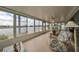 Comfortable sunroom providing views of the water and neighborhood at 407 Blackhawk Cir, Sun City Center, FL 33573