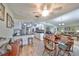 An open floor plan showing the living room, kitchen with granite countertops, and breakfast bar at 407 Blackhawk Cir, Sun City Center, FL 33573