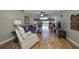 Spacious living room with hardwood floors, ceiling fan, and comfortable seating arrangement at 407 Blackhawk Cir, Sun City Center, FL 33573