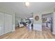 Spacious living room with hardwood floors and a view of the kitchen at 407 Blackhawk Cir, Sun City Center, FL 33573