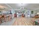 View of the open floor plan with combined dining, kitchen, and living room area at 407 Blackhawk Cir, Sun City Center, FL 33573