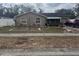 Ranch-style home with landscaped yard and driveway at 515 Cottage Ln, Brandon, FL 33510