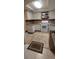Bright kitchen featuring updated appliances and wood-look flooring at 515 Cottage Ln, Brandon, FL 33510