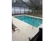 Screened-in pool area with concrete decking at 515 Cottage Ln, Brandon, FL 33510
