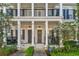 Inviting front porch with dual rocking chairs and decorative wreath offers a cozy curb appeal at 515 Gilman N Ct, St Petersburg, FL 33716