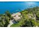 Large waterfront home with unique circular design and private dock at 6119 Gnarled Oak Ln, Englewood, FL 34223