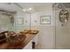 Elegant bathroom with a modern sink, glass shower, and decorative tile at 6119 Gnarled Oak Ln, Englewood, FL 34223