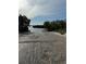 Concrete boat ramp leading to calm waters at 6119 Gnarled Oak Ln, Englewood, FL 34223