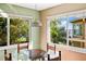 Bright breakfast nook with water views and seating for four at 6119 Gnarled Oak Ln, Englewood, FL 34223
