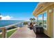 Deck with water views and comfortable seating at 6119 Gnarled Oak Ln, Englewood, FL 34223