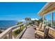 Spacious deck overlooking the water with chairs at 6119 Gnarled Oak Ln, Englewood, FL 34223