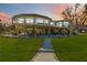 Stunning elevated home with large deck and walkway, offering scenic views at 6119 Gnarled Oak Ln, Englewood, FL 34223