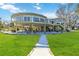 Elevated home with expansive decks, offering stunning waterfront views at 6119 Gnarled Oak Ln, Englewood, FL 34223