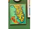 Framed vintage Florida map print on wall at 6119 Gnarled Oak Ln, Englewood, FL 34223