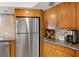 Updated kitchen with stainless steel appliances and granite countertops at 6119 Gnarled Oak Ln, Englewood, FL 34223
