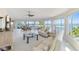 Spacious living area showcasing water views and ample seating at 6119 Gnarled Oak Ln, Englewood, FL 34223