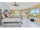 Large main bedroom with water views and plush bedding at 6119 Gnarled Oak Ln, Englewood, FL 34223