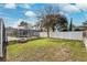 Landscaped backyard with a screened pool area at 15106 Meadowlake St, Odessa, FL 33556