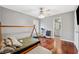 Charming bedroom with hardwood floors and access to bathroom at 15106 Meadowlake St, Odessa, FL 33556