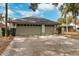 Two-car garage with light gray doors at 15106 Meadowlake St, Odessa, FL 33556