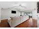 Hardwood floors, vaulted ceilings, and large sectional sofa at 15106 Meadowlake St, Odessa, FL 33556