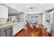 Open kitchen with stainless steel appliances and hardwood floors at 15106 Meadowlake St, Odessa, FL 33556