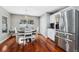 Bright kitchen nook with hardwood floors and a round dining table at 15106 Meadowlake St, Odessa, FL 33556