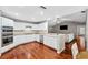 Modern kitchen with white cabinets, stainless steel appliances and granite countertops at 15106 Meadowlake St, Odessa, FL 33556