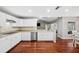 Modern kitchen with white cabinets, stainless steel appliances and granite countertops at 15106 Meadowlake St, Odessa, FL 33556