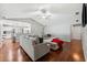 Open concept living room with hardwood floors, looking toward the kitchen at 15106 Meadowlake St, Odessa, FL 33556