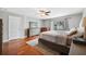 Main bedroom with hardwood floors and access to backyard at 15106 Meadowlake St, Odessa, FL 33556