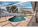 Inviting kidney-shaped pool with a screened enclosure at 15106 Meadowlake St, Odessa, FL 33556