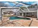Enjoy this refreshing kidney-shaped pool and screened patio at 15106 Meadowlake St, Odessa, FL 33556