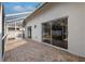 Spacious screened patio with brick pavers and sliding doors at 15106 Meadowlake St, Odessa, FL 33556