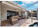 Relaxing screened patio with seating area and pool access at 15106 Meadowlake St, Odessa, FL 33556