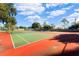 Two tennis courts with red and green surface at 15106 Meadowlake St, Odessa, FL 33556