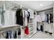 Spacious walk-in closet with ample shelving and hanging rods at 15106 Meadowlake St, Odessa, FL 33556