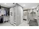 Large walk-in closet with custom shelving and drawers at 15106 Meadowlake St, Odessa, FL 33556