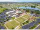 Aerial view of community clubhouse, pool, and green spaces at 1720 Flamingo Ln, Sun City Center, FL 33573