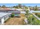 An aerial view shows the pool, fenced yard and landscaping of this well-kept property at 1720 Flamingo Ln, Sun City Center, FL 33573