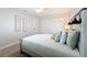 Cozy bedroom featuring plush carpet, sconces, and a spacious closet at 1720 Flamingo Ln, Sun City Center, FL 33573